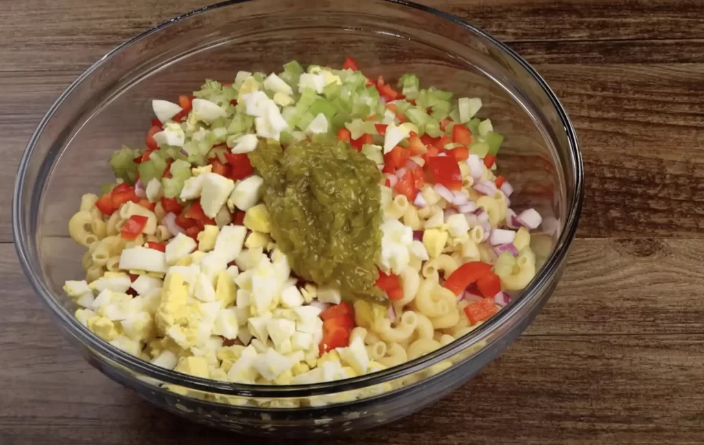 combine ingredients for macaroni salad